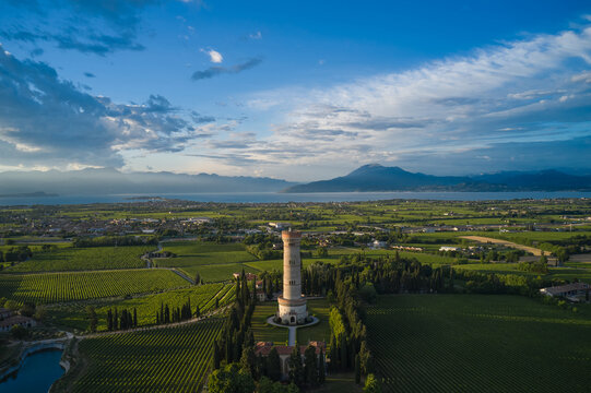 Tower of San Martino della Battaglia aerial view, Surrounded by cypresses and vineyards. Panorama of the Tower of San Martino della Battaglia on Lake Garda in Italy.