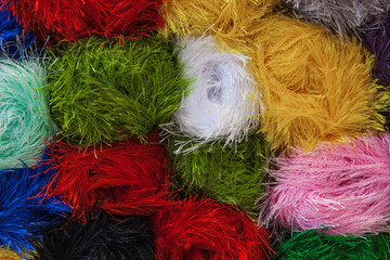 Twisted multi-colored threads for knitting in various colors.
