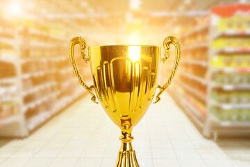 supermarket award, grocery trophy, gold prize for the best store, cup on the background of a...