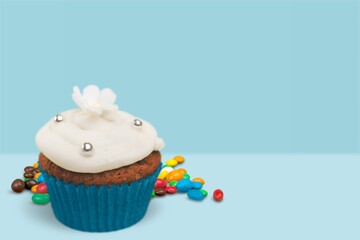 Celebration birthday cupcake on color background