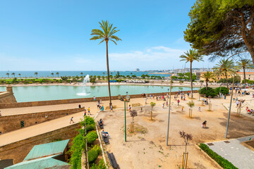 Obraz na płótnie Canvas View from the steps of the Palma Cathedral looking over the Mediterranean Sea, cruise port, and pond, in Palma de Mallorca, Spain.