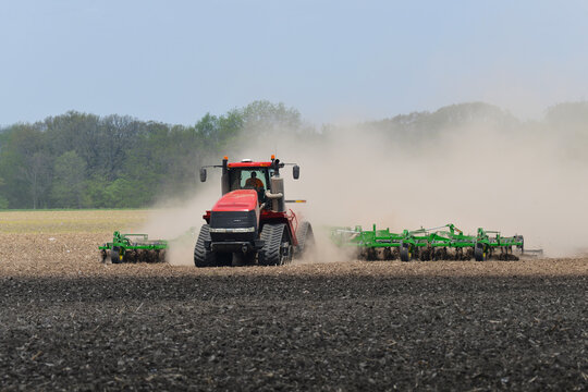 Streator, Illinois - USA - May 12, 2022; Case IH Steiger 540 Quadtrac pulling a John Deere cultivator for spring planting