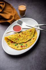 Indian Spiced Masala Omelet filled with fresh vegetable, healthy meal