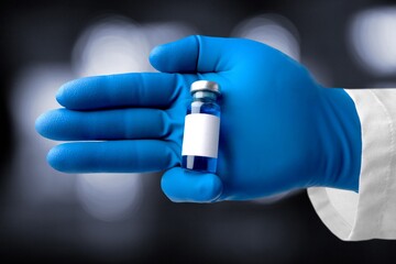 A vial of vaccine for Monkeypox virus, on outdoor background