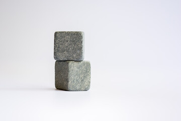 Two stone cubes one above the other