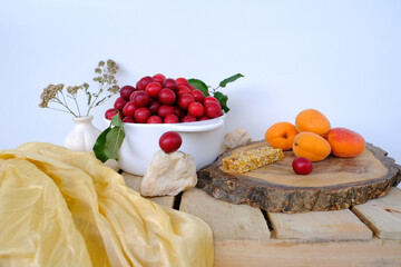 fresh juice fruit and berry low-calorie mousse, dessert in glass with bubble tea, ripe apricots, cherry plums, pears, muesli bar, concept of healthy eating, vegan diet, raw food, healthy food