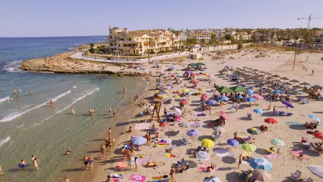 Aerial view of La Zenia, Orihuela during sunny summer day. Costa Blanca. Spain. Travel and tourism concept. Cinematic 4K