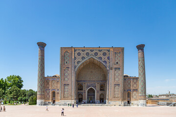 Fototapeta na wymiar SAMARKAND, UZBEKISTAN - JUNE 09, 2022: Registan Ulugh Beg Madrasah is a part of Registan ancient city.