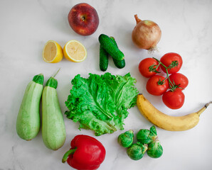 Various fruits and vegetables on a light background