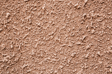Texture of dark beige plaster wall as background, closeup