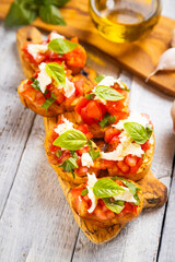 Italian bruschetta bread with tomato, basil and mozzarella cheese