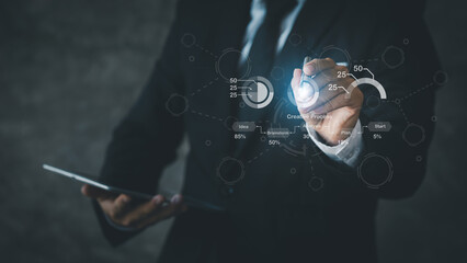 Businessman points to hologram iconcompany financial reports, graphics showing financial and numerical growth data. The concept of financial management to grow and be profitable.