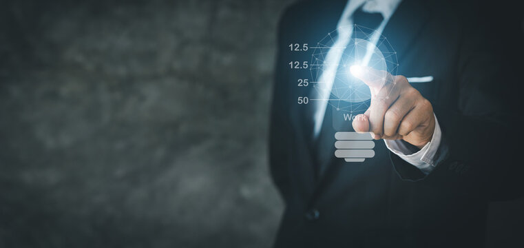 Businessman points to hologram iconcompany financial reports, graphics showing financial and numerical growth data. The concept of financial management to grow and be profitable.