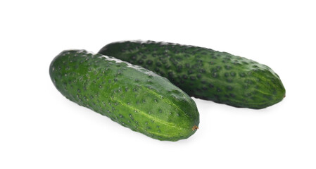 Whole fresh green cucumbers on white background