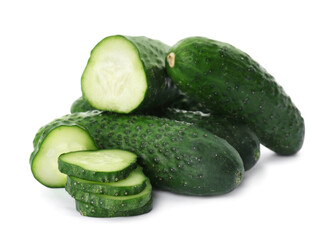 Whole and cut cucumbers on white background