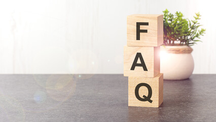 text faq on wooden dice standing on top of each other
