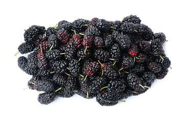 Pile of ripe black mulberries on white background, top view