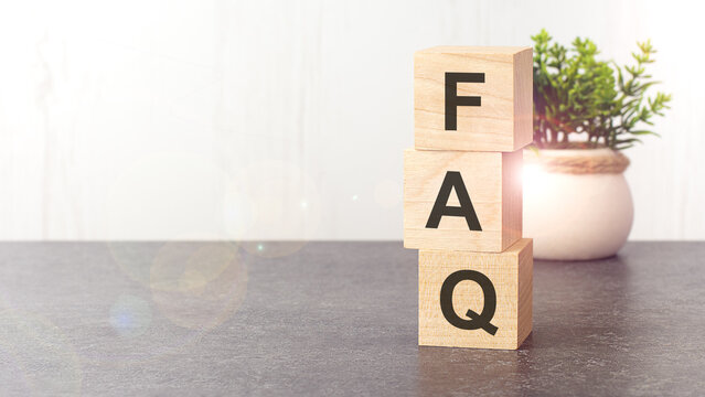 text faq on wooden dice standing on top of each other