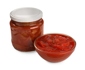 Glass jar and bowl of delicious lecho on white background