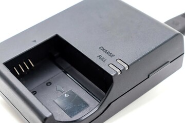 battery charger for photo camera on white background