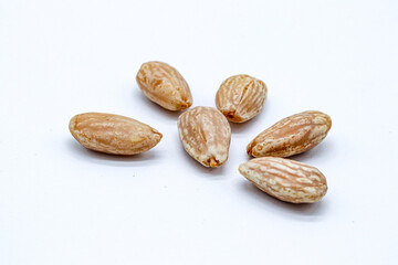peeled almonds on white background