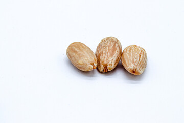 peeled almonds on white background