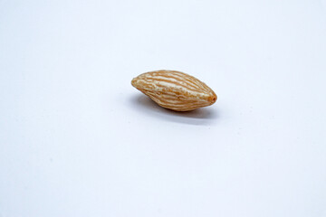 peeled almond on white background