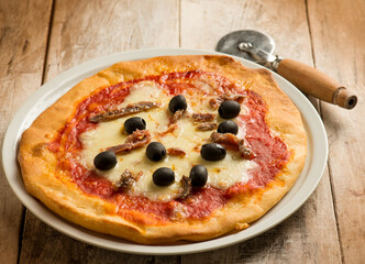 pizza margherita with  anchovies and black olives
