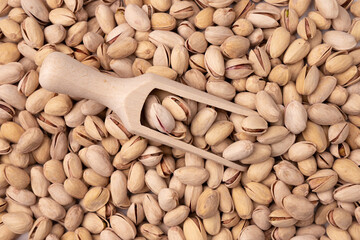 background of pistachio nuts close up, top view