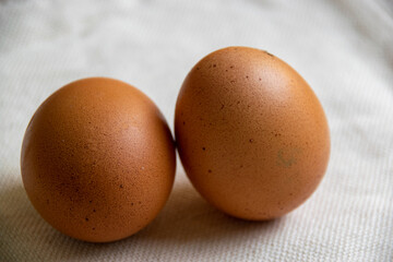 chicken eggs on the background of white burlap,healthy food