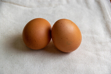 chicken eggs on the background of white burlap,healthy food