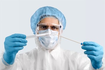 A medical worker holds a test tube with Monkeypox virus infected sample. Epidemic of smallpox...