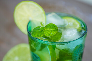 glass of mojito, tropical drink with mint and brown sugar