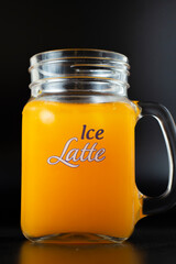 Orange lemonade glass with ice chips
