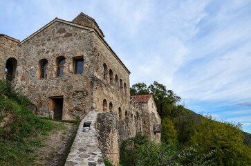 Fototapeta na wymiar View to Nekresi Monastery complex located on top of a hill overlooking the Alazani valley in the Kakheti region of Georgia