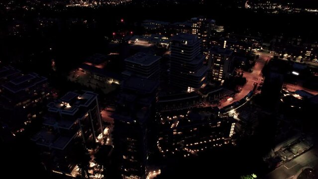 Night drone aerial footage of Simon Fraser University, Vancouver, BC, city lights, university campus. 4K 24FPS H.265