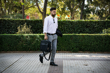 businessman walking after work, Seville, Spain