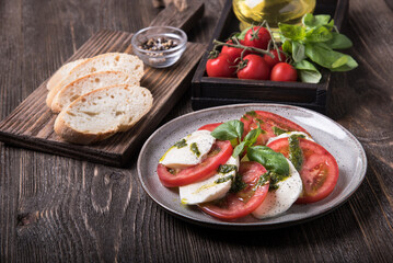 Caprese salad on wooden table