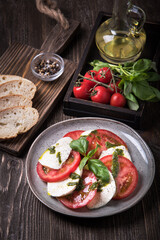 Caprese salad on wooden table