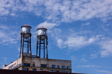 Old Water Towers On Top Of Industrial Building