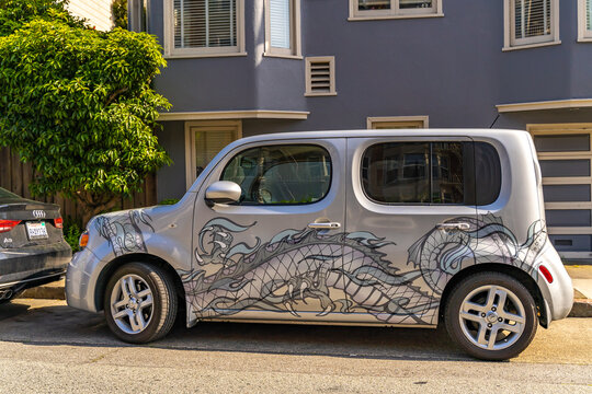 Nissan Cube With Tuning Parked On The Road.	