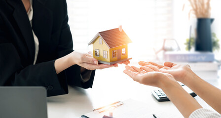 Real estate agent company delivering new houses to customers after agreeing to make a home purchase...