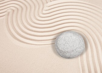 Balance. Good and evil. Stone garden for meditation. Japanese Zen concept. Round stones on a sandy background.