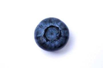 blueberry lies on a white background