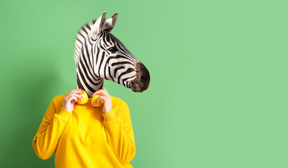 Woman with head of zebra and headphones on green background - obrazy, fototapety, plakaty