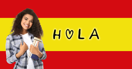 African-American female student and word HOLA (HELLO) against flag of Spain - obrazy, fototapety, plakaty