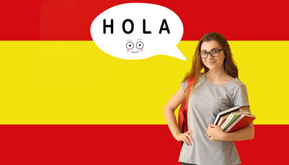 Female student and speech bubble with word HOLA (HELLO) against flag of Spain © Pixel-Shot