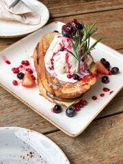 Delicious homemade french-toast ice cream with mutl berries fruits