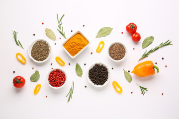 Beautiful composition with different spices and vegetables on white background