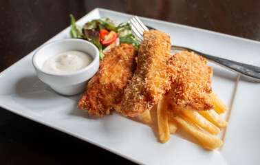 deep fried fish and chips with salad and sour sauce
